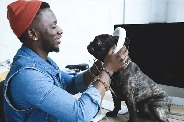 Resident Laughing with Puppy in Apartment