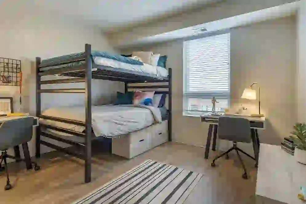 Bunk Beds and Desks shown in Student Apartment