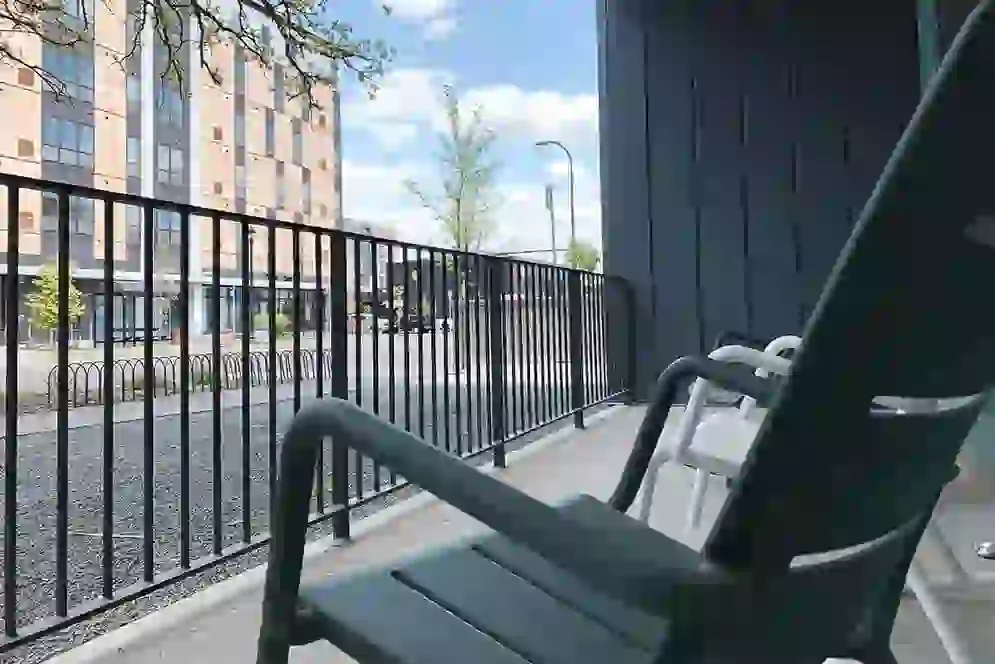 Patio furniture overlooking courtyard at UNCOMMON Dinkytown