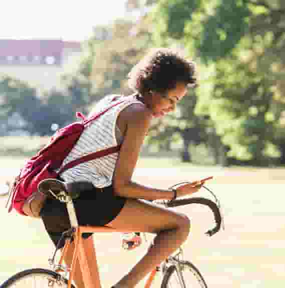 UMN Student Biking to Class