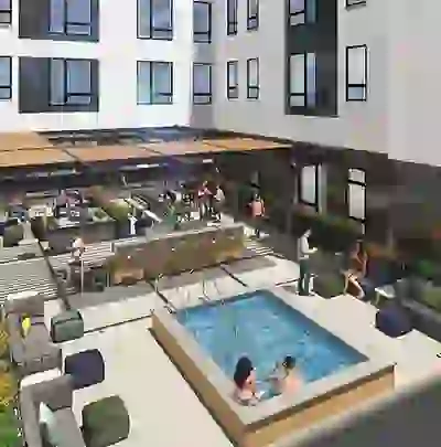 Aerial View of Courtyard with Hot Tub, TVs, Grills, and Lounge