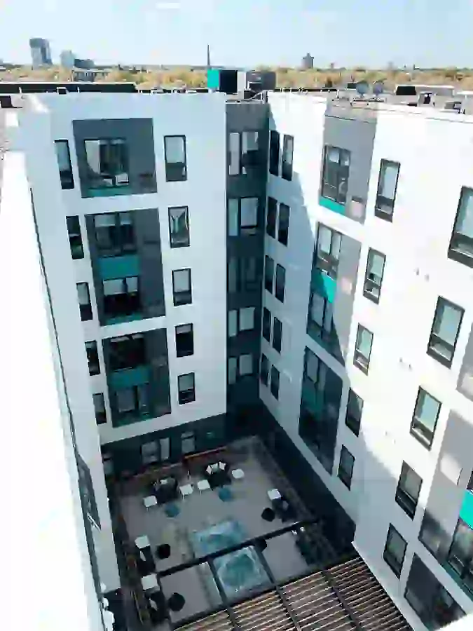 Exterior View of UNCOMMON Dinkytown Showing Courtyard and City Skyline